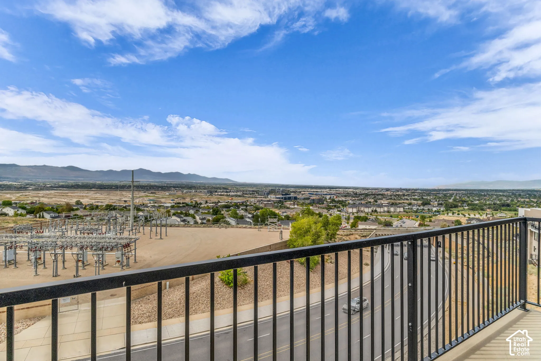 Expansive valley landscape with a broad urban expanse