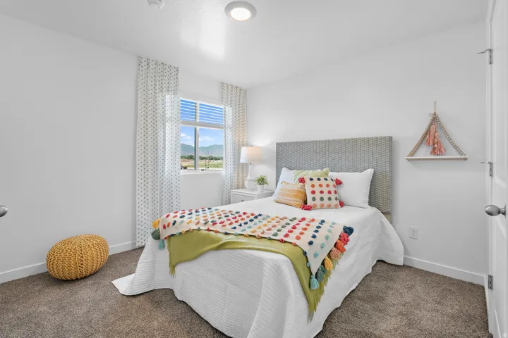 White walls, carpeted flooring, window with blinds, recessed lighting, and a white interior door