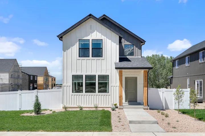 Modern two-story residence with white board-and-batten siding