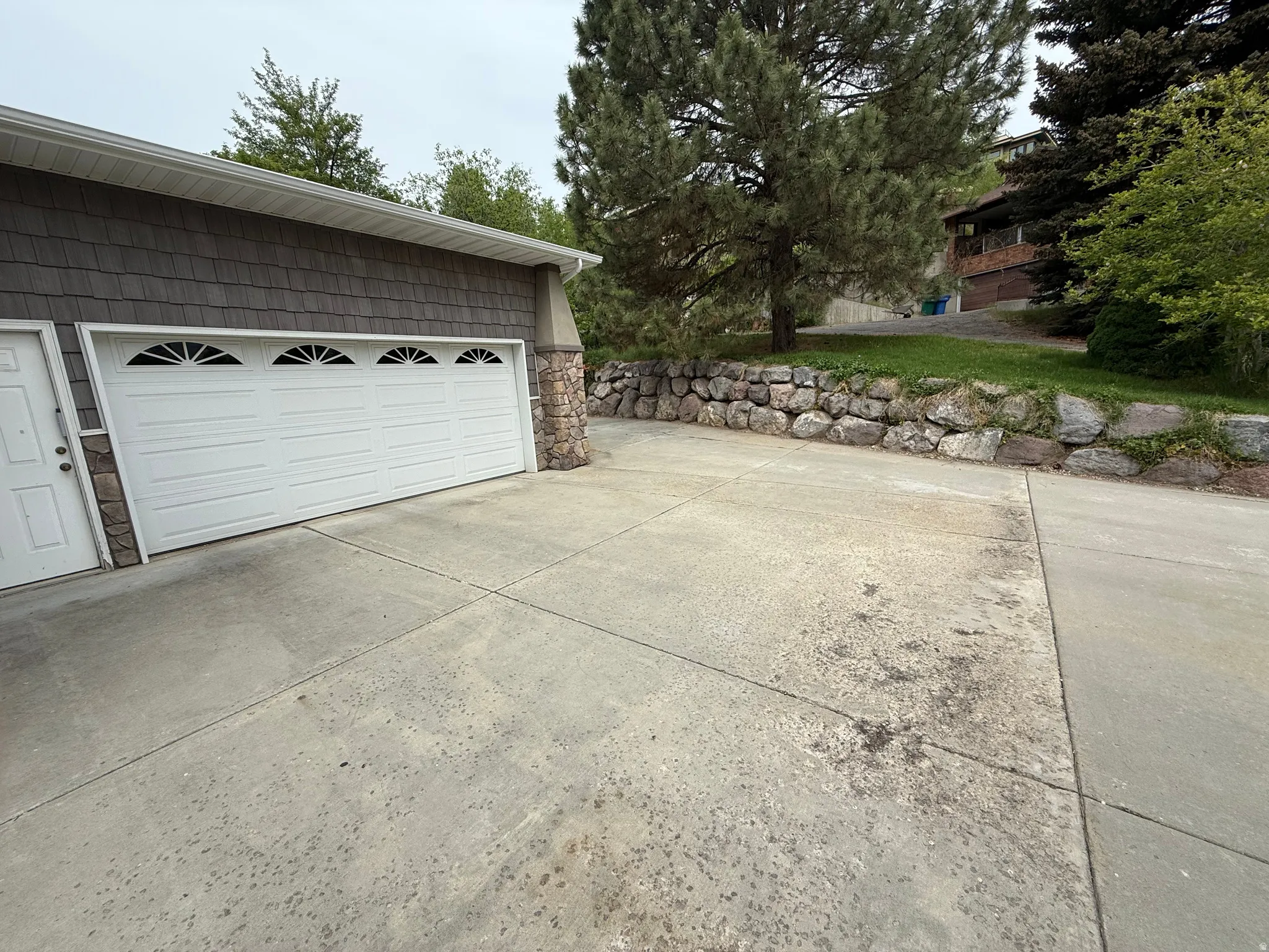 Attached two-car garage with arched window detailing