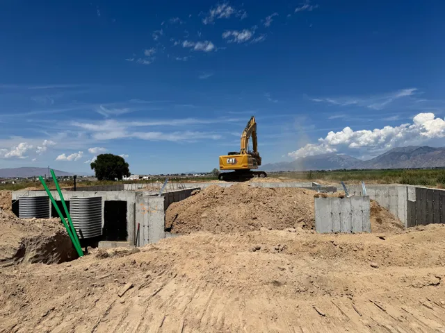Concrete foundation with corrugated metal structures