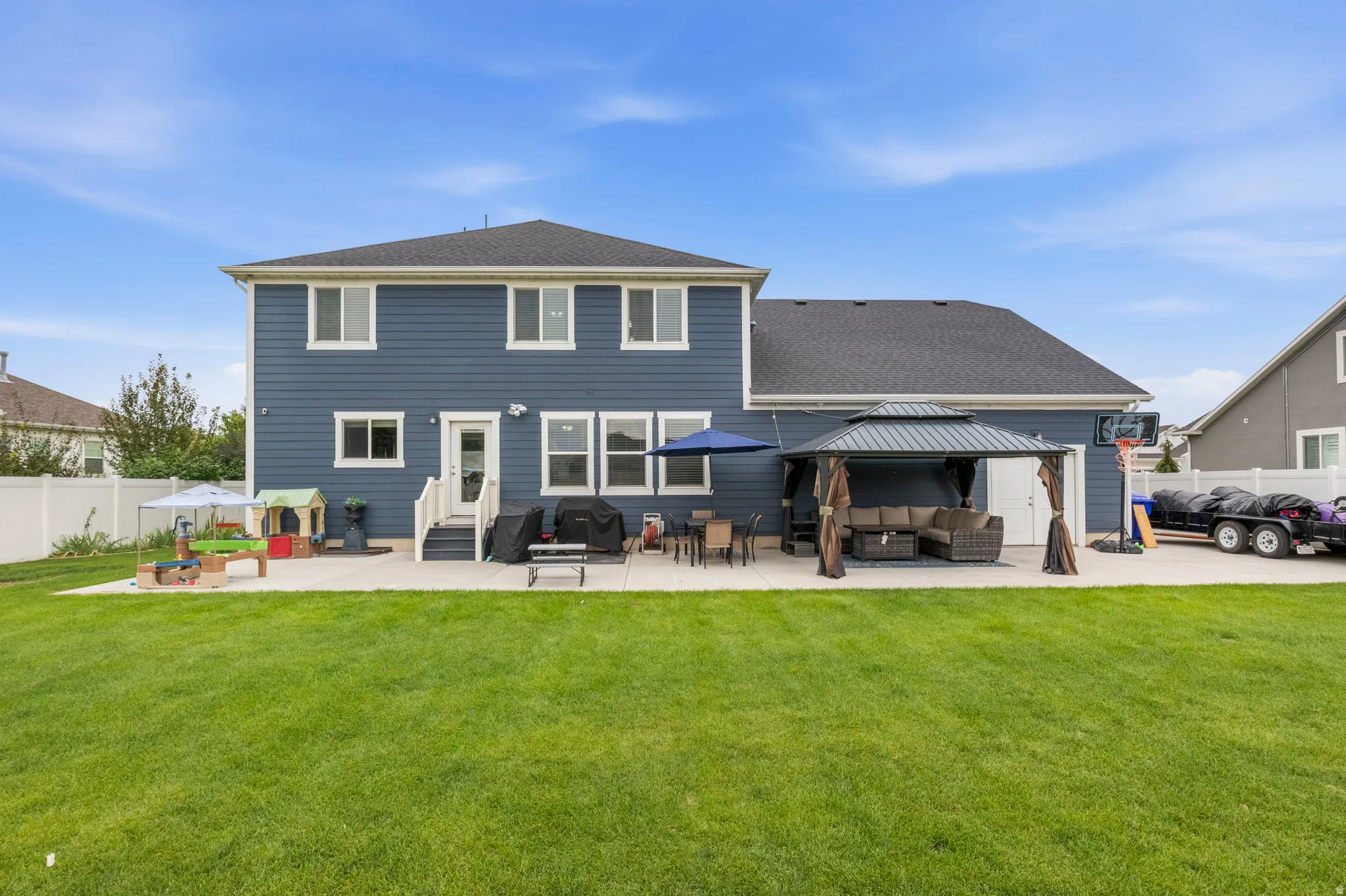 Two-story exterior with blue siding and white trim