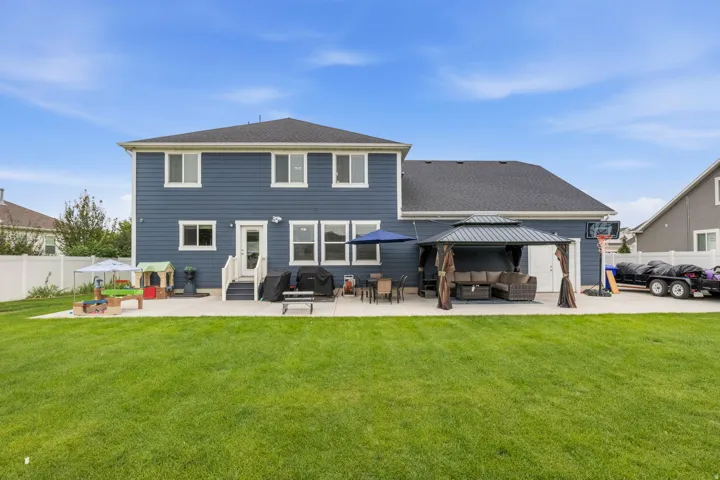 Two-story exterior with blue siding and white trim