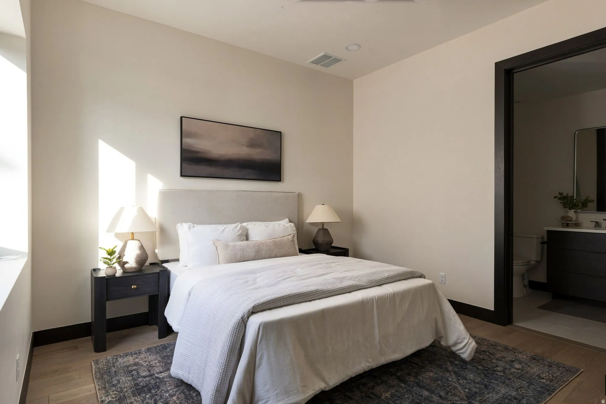 Recessed lighting, wood-finish flooring, dark trim, and light-toned walls