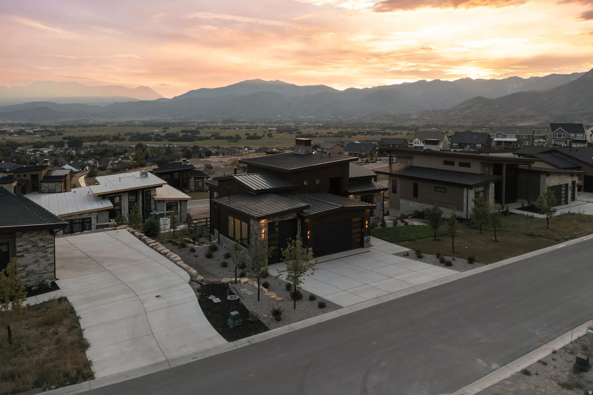 Modern architecture featuring stone and wood-look siding