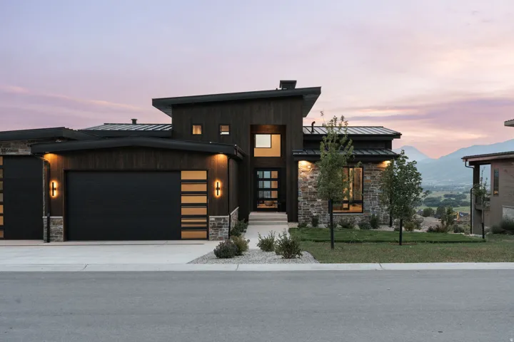 Modern architectural exterior featuring wood paneling and stone accents
