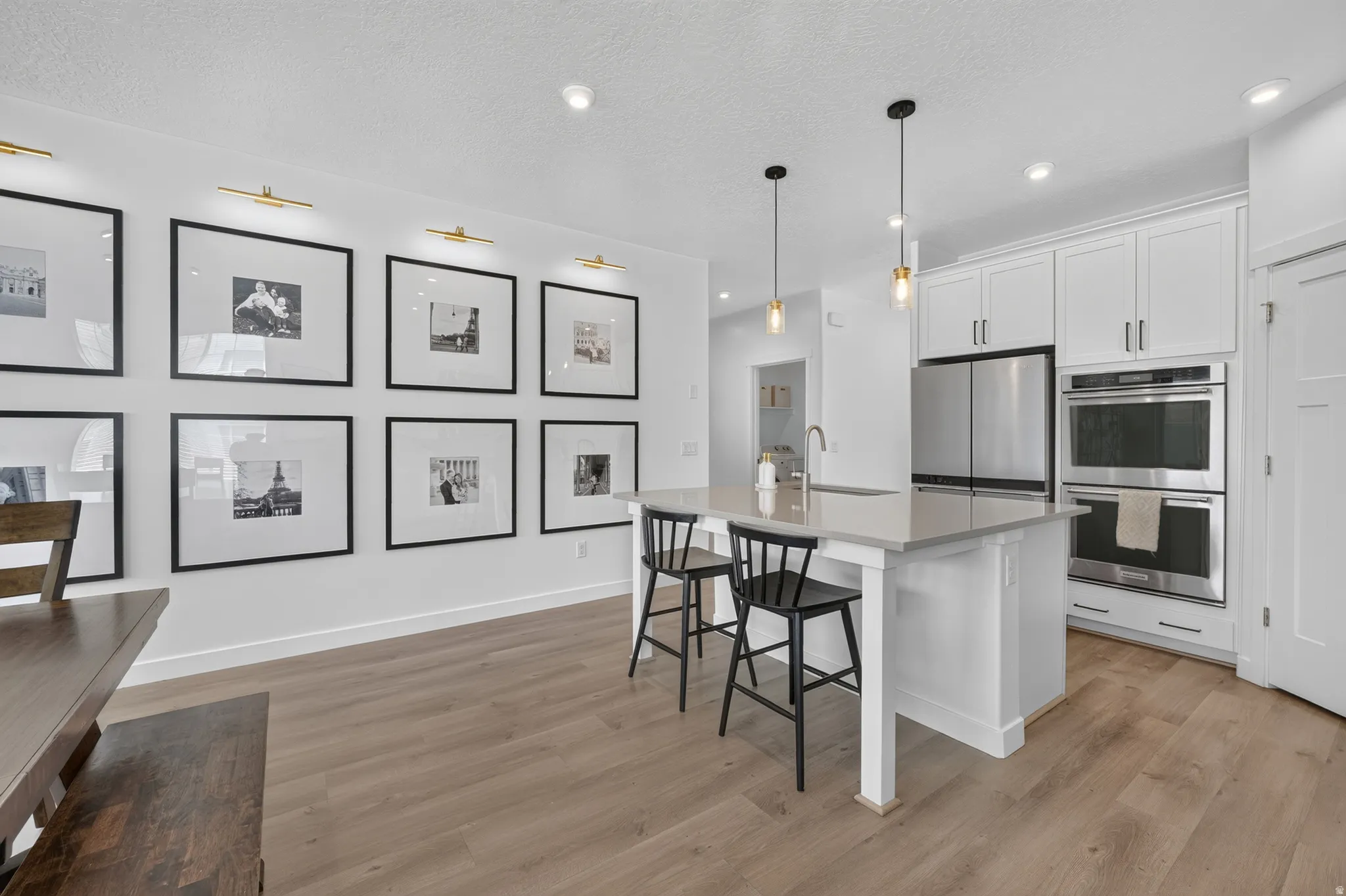 Kitchen island with a light-toned countertop and built-in sink