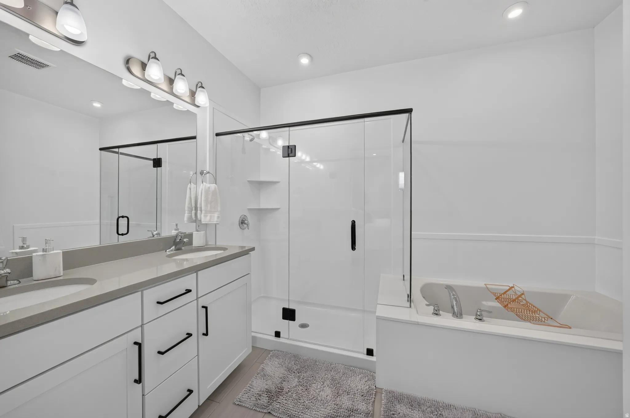 Double vanity with undermount sinks and light gray countertop