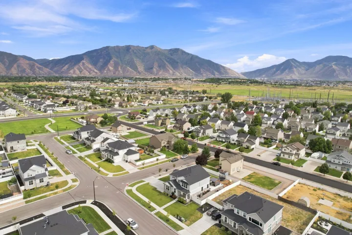 Residential development featuring multiple properties with landscaped yards