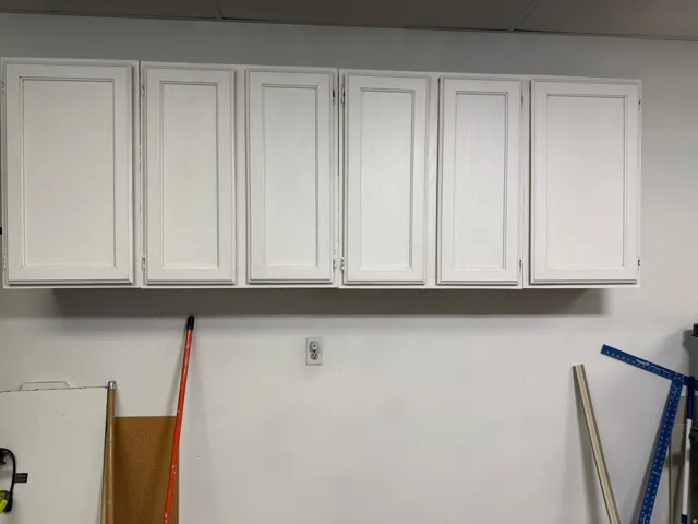 White shaker-style cabinetry with five individual units