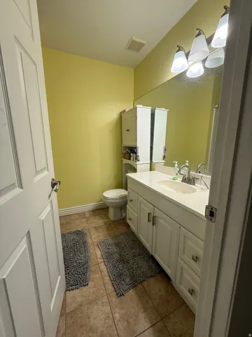 White vanity with dual doors and multiple drawers