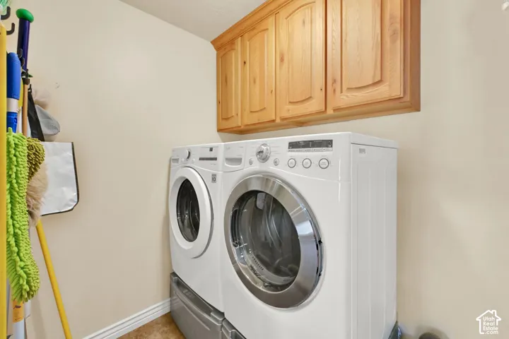 Light wood-finish cabinetry provides overhead storage