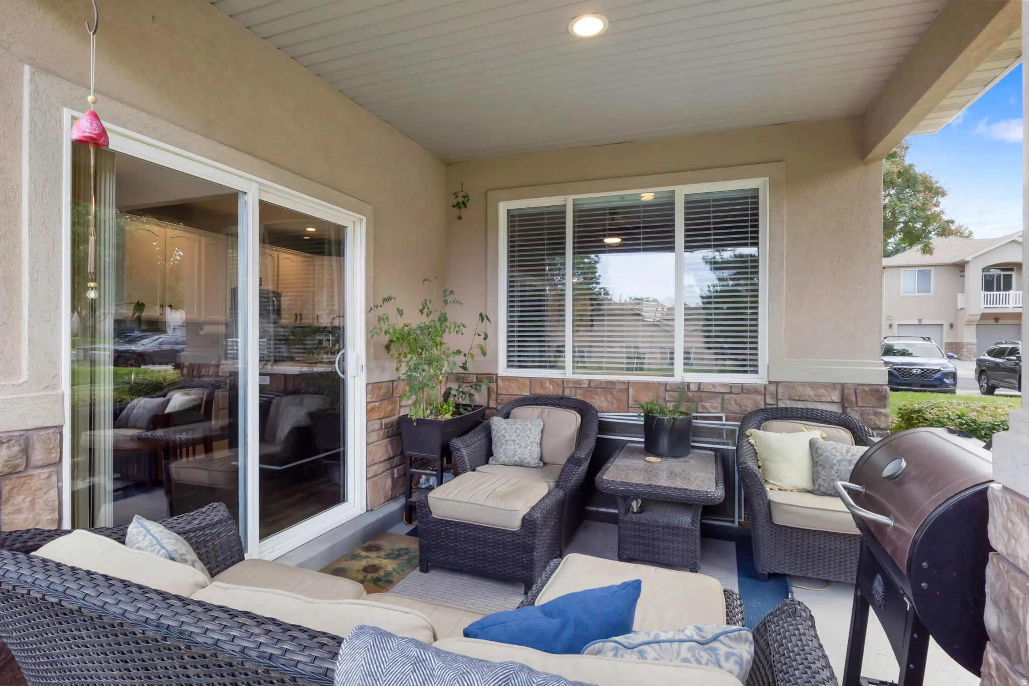 Covered patio with recessed lighting and a sliding glass door