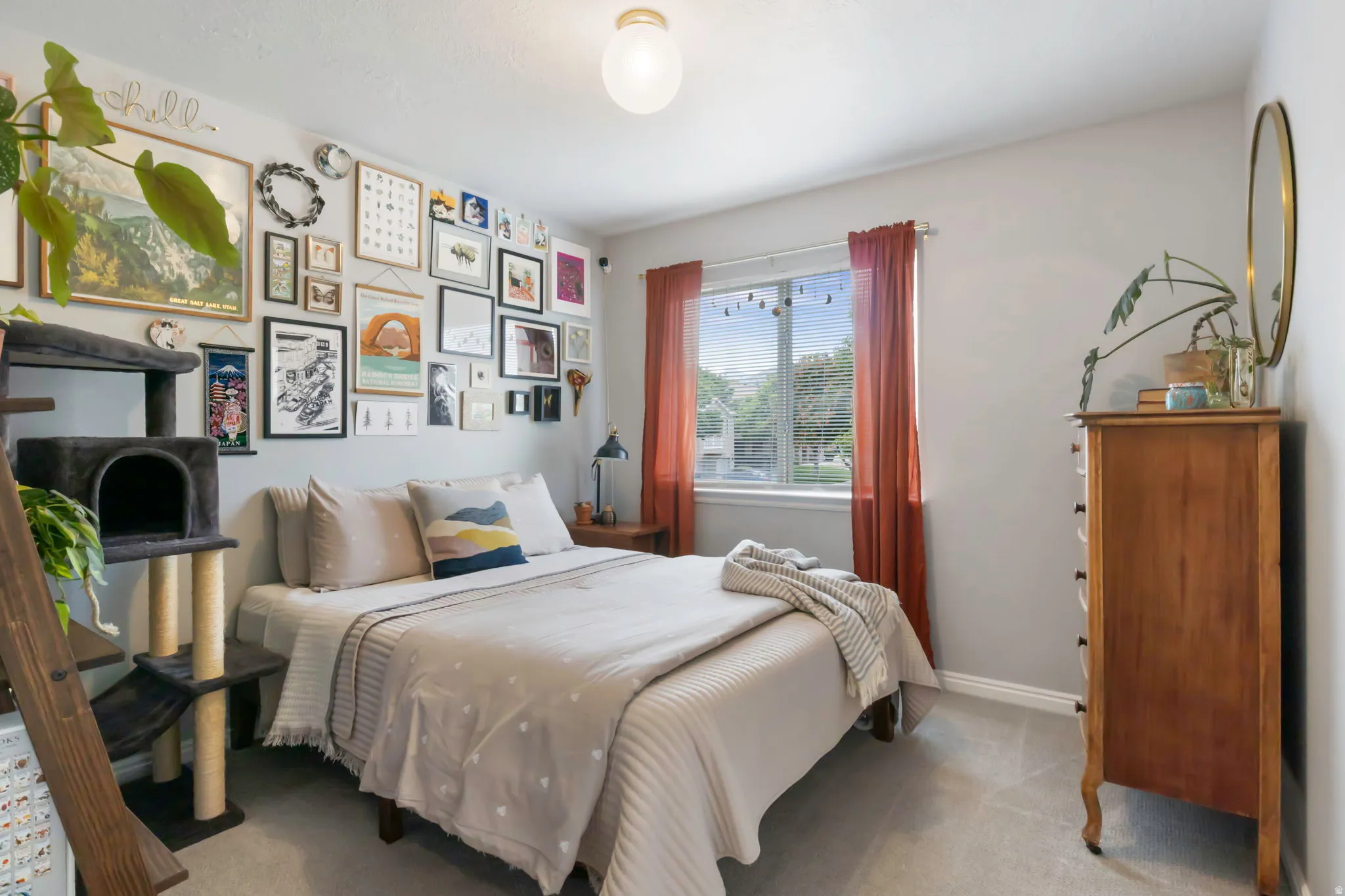 Neutral-toned walls complement light-toned carpeting and a large window