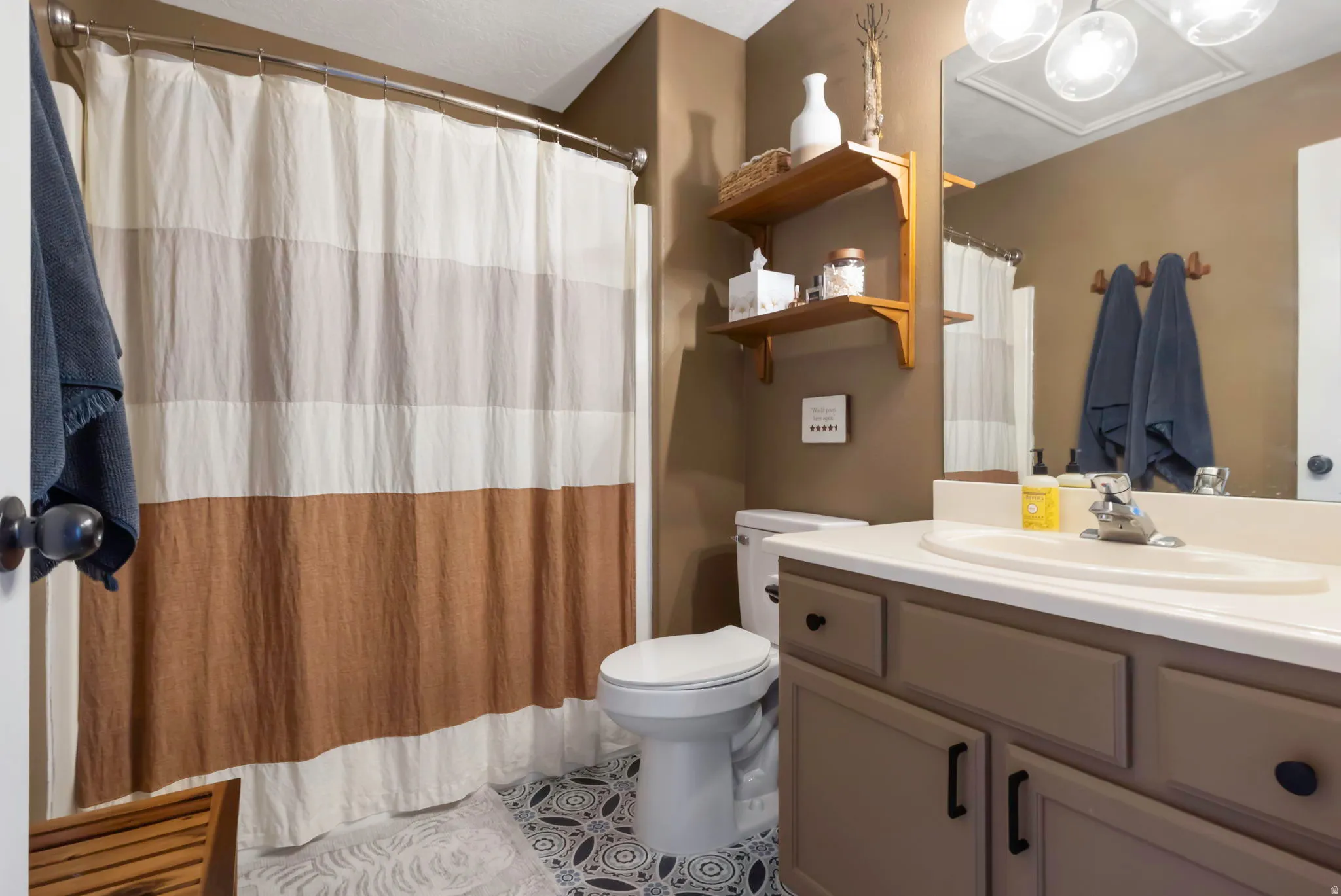 Primary bathroom featuring vanity and  bathtub/shower combo
