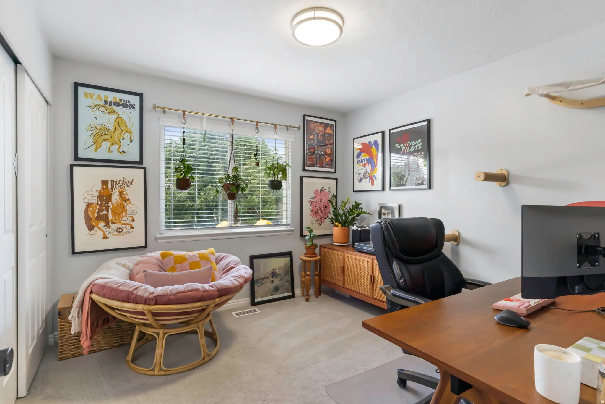Bedroom being used as an office with recessed lighting, large window with blinds