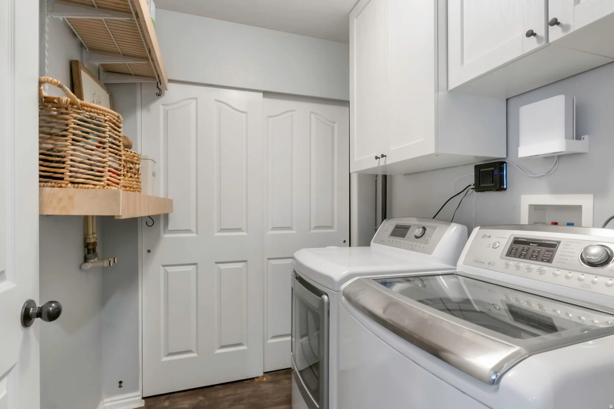 Built-in shelving and upper cabinetry provide storage