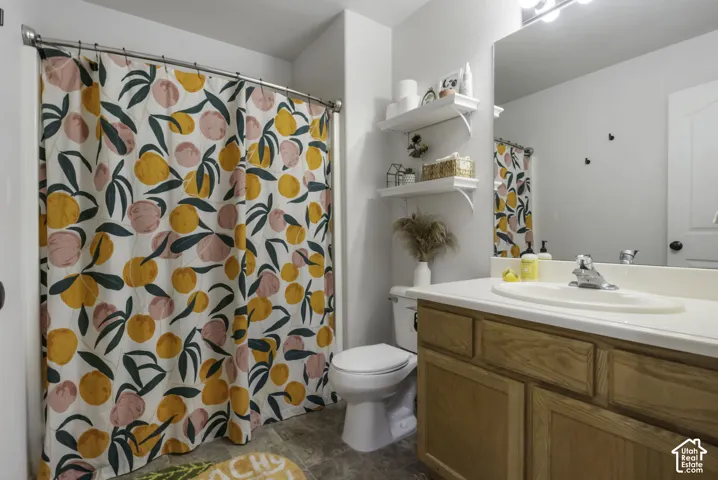Hallway bathroom featuring vanity and bathtub/shower combo