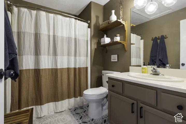 Primary bathroom featuring vanity and  bathtub/shower combo