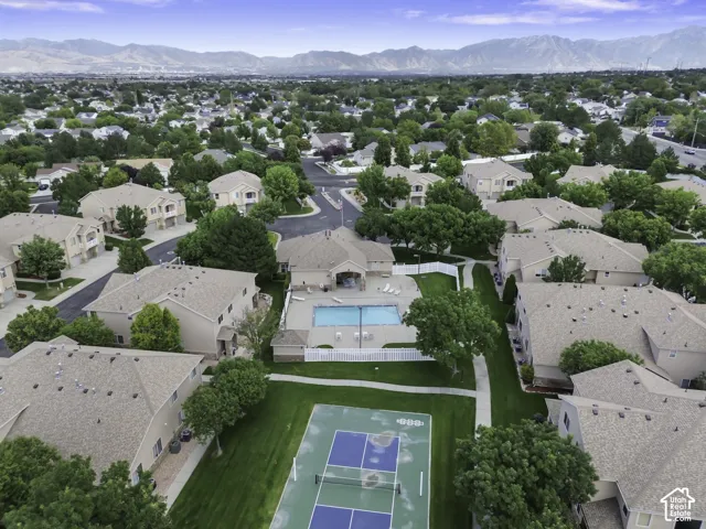 Community grounds featuring a tennis court, swimming pool, and dedicated pathways