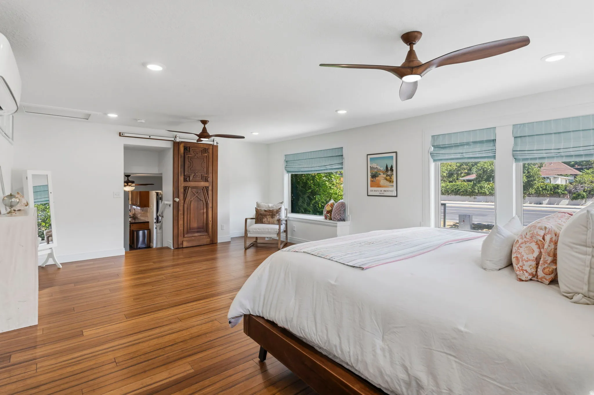 Primary Suite Hardwood flooring, recessed lighting, and dual ceiling fans