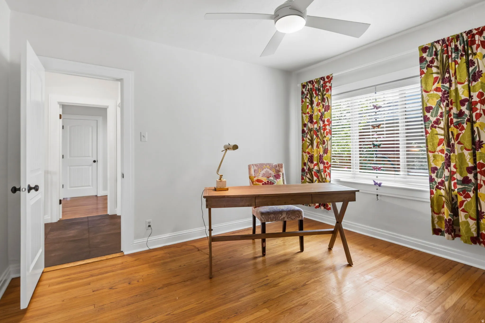 Bedroom 3 or office Hardwood flooring, white painted walls, window with blinds, ceiling fan with integrated lighting, and white trim molding