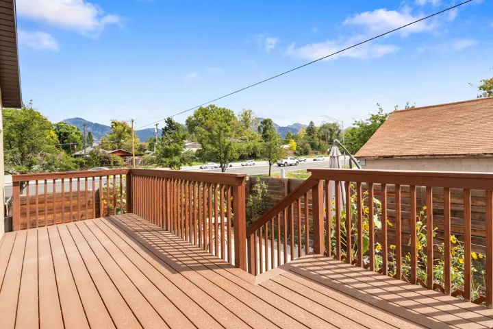 Expansive outdoor deck with wood-finish railing and decking