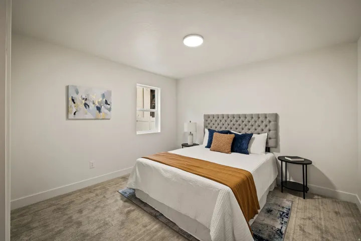 Recessed window, overhead flush-mount lighting, and solid surface flooring