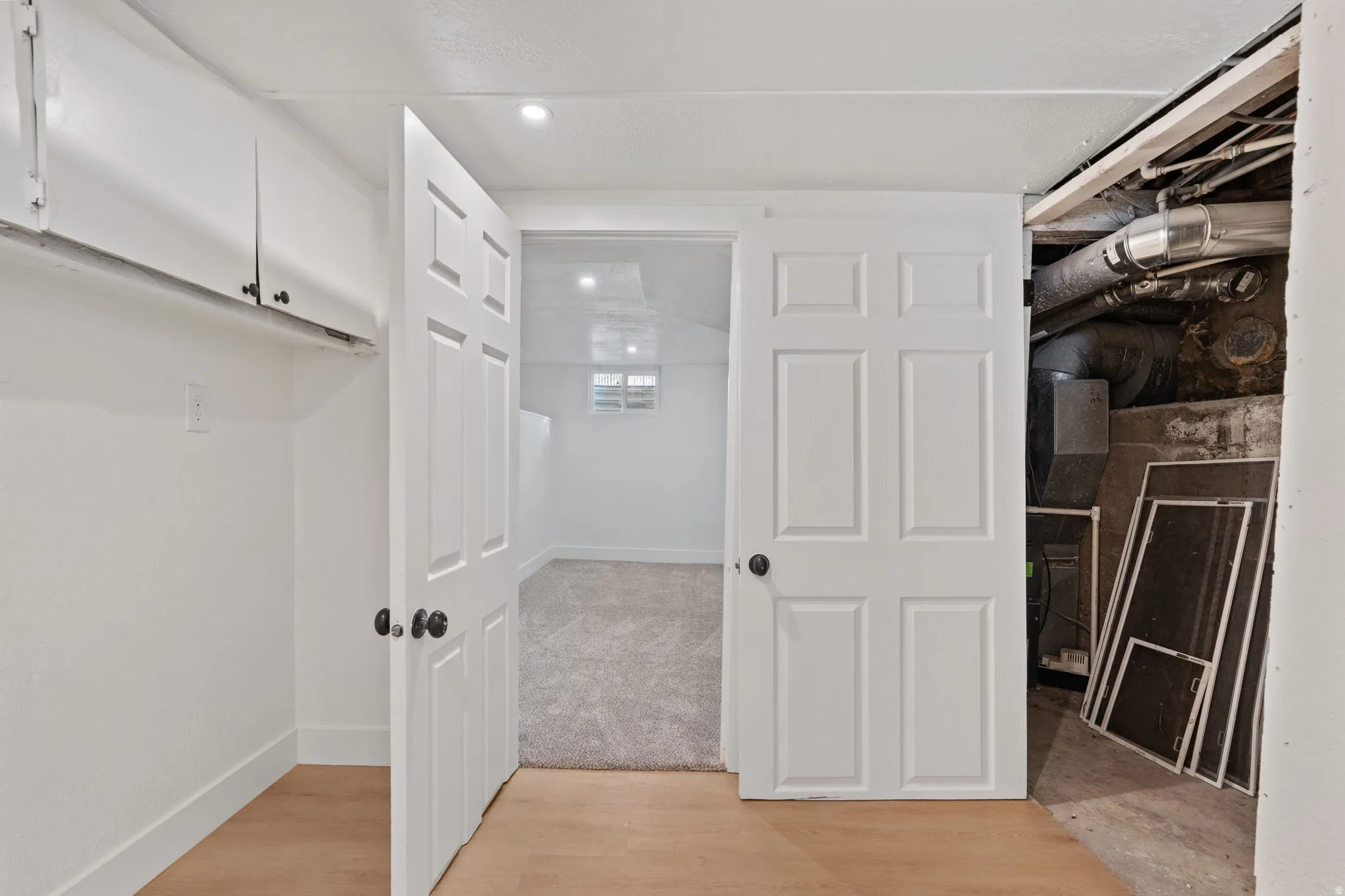 White paneled doors with matte black hardware