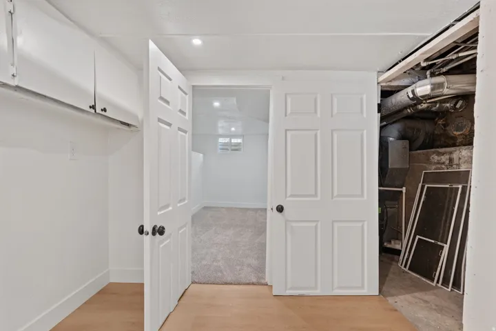 White paneled doors with matte black hardware