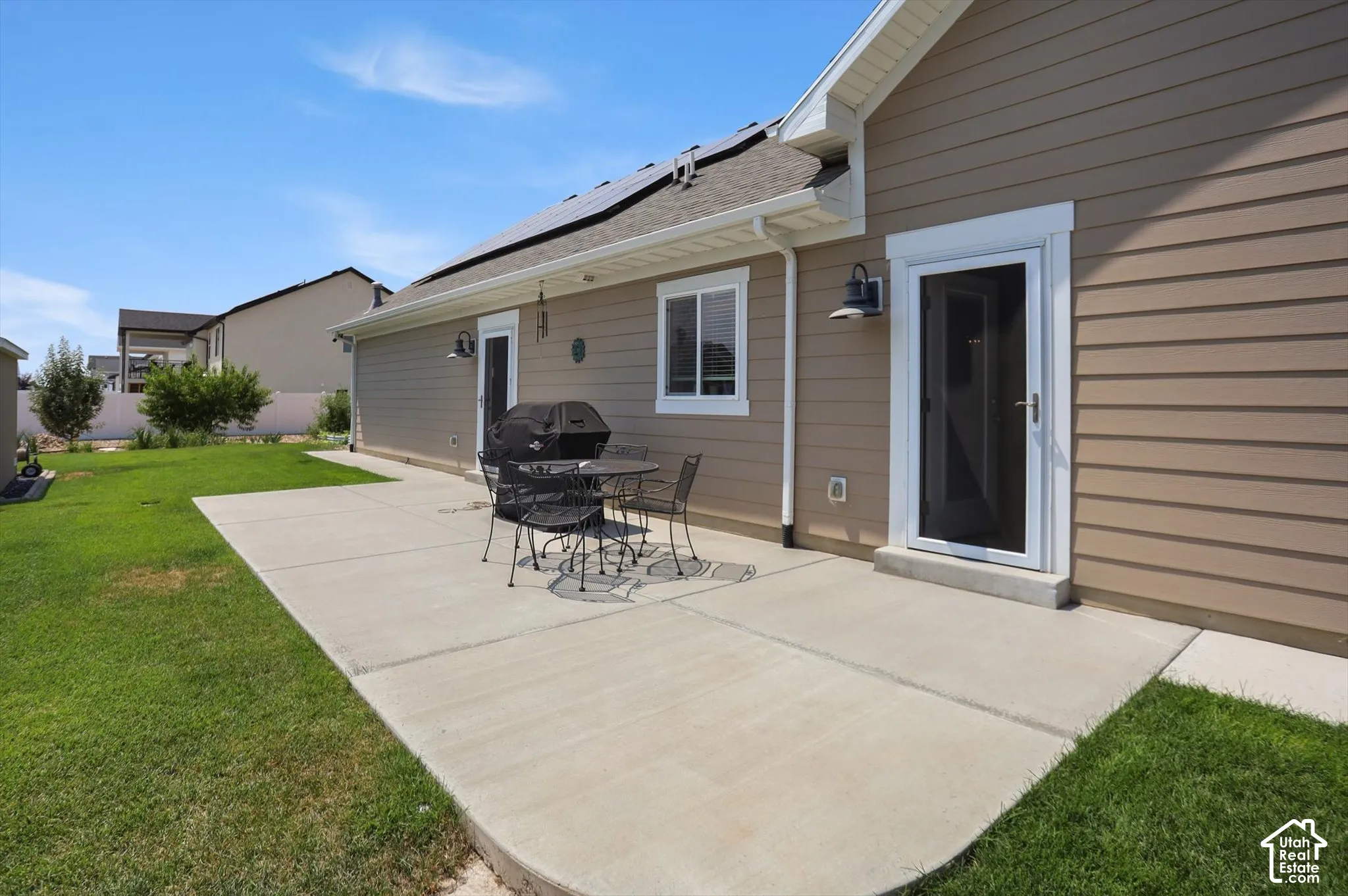 Expansive concrete patio with direct access to the interior