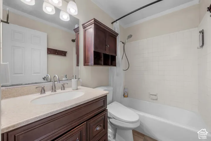 Bathroom featuring a spacious vanity with an oval sink and a light-toned countertop