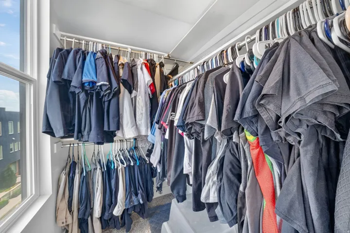 Primary bedroom walk in closet
