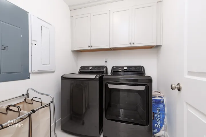 White shaker-style cabinetry with minimalist hardware