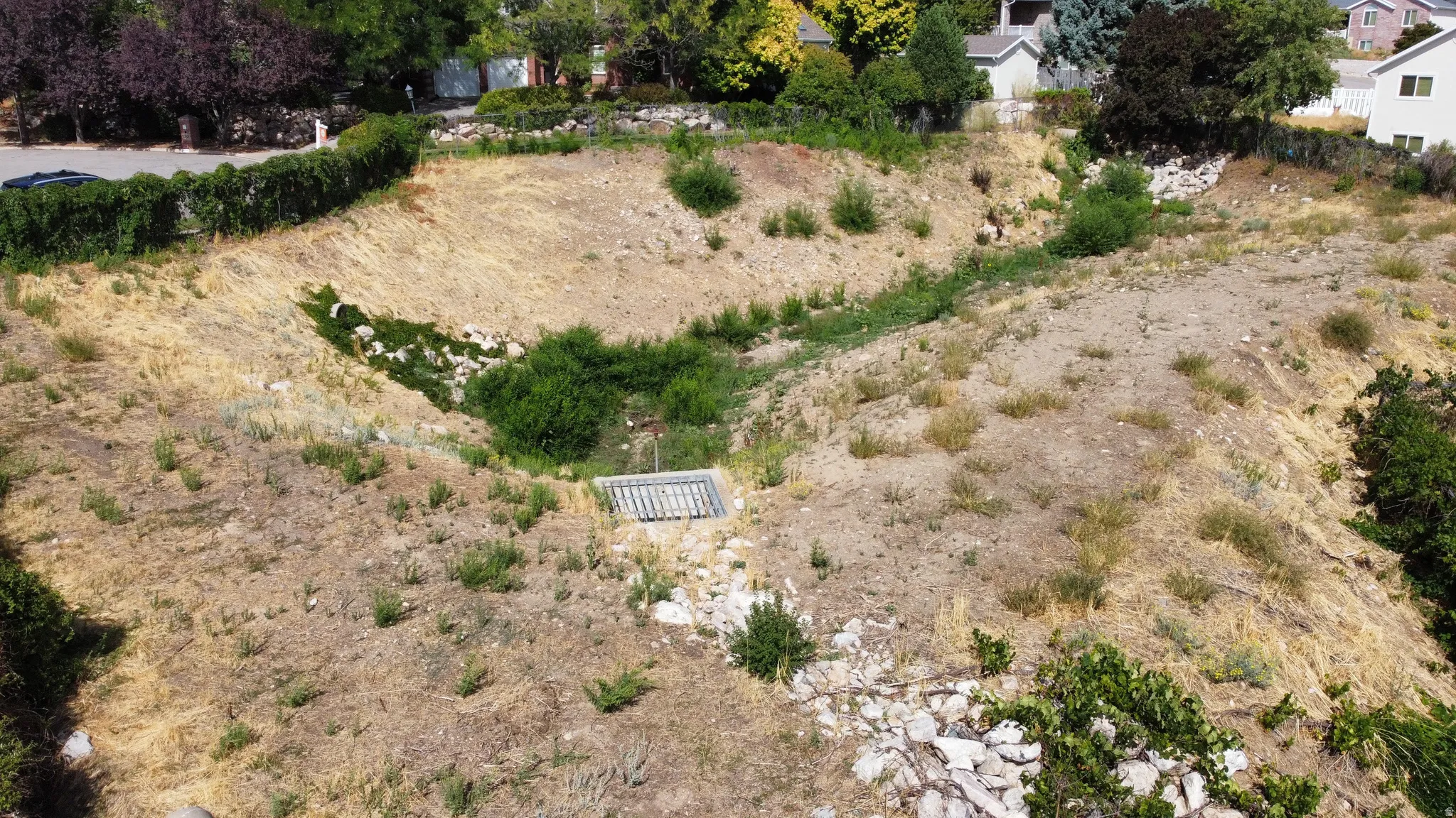 This is a shot of the vacant lot land drain to the East, so you'll never have neighbors on that side!