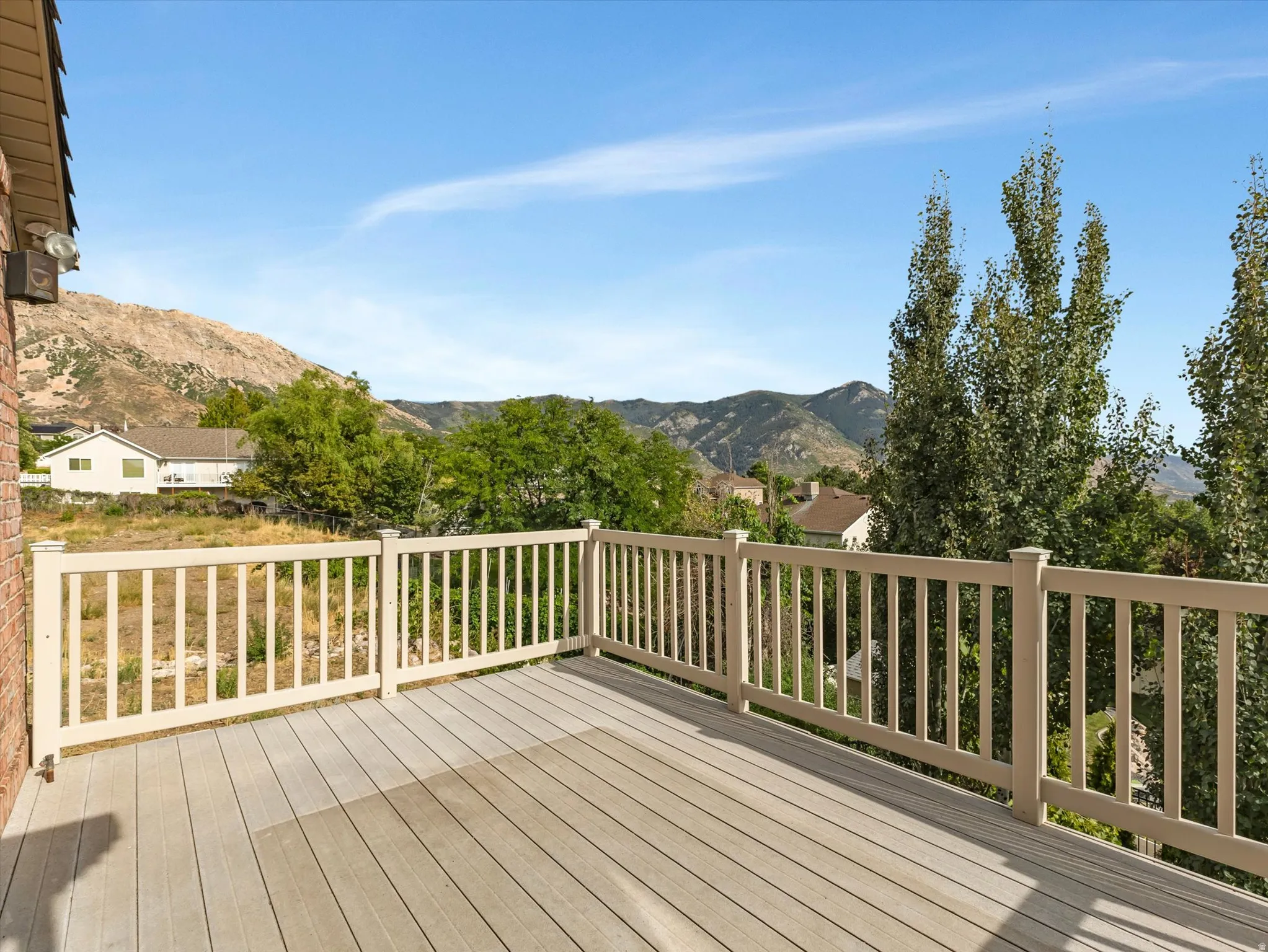 Amazing Views!  Second deck off Master Suite with composite decking, white railing, and mountain scenery.