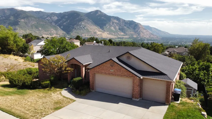 Brick exterior with an attached two-car garage