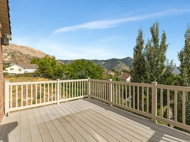 Amazing Views!  Second deck off Master Suite with composite decking, white railing, and mountain scenery.