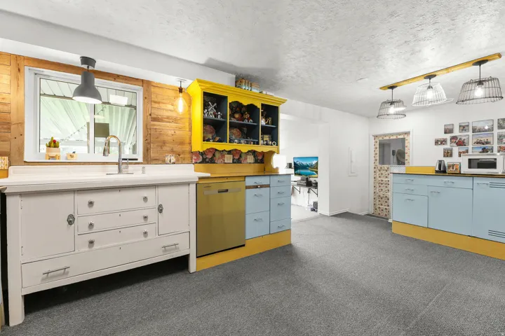 Abundant cabinetry, with a great flow from the living room, through the kitchen to the dining area.