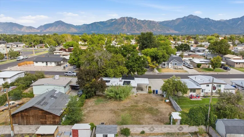 Expansive lot with mountain backdrop and mature trees