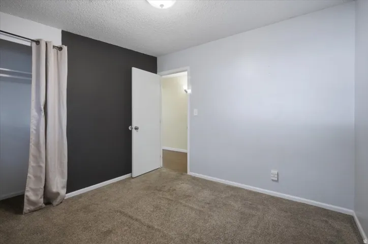 Wall-to-wall carpeting and neutral wall tones