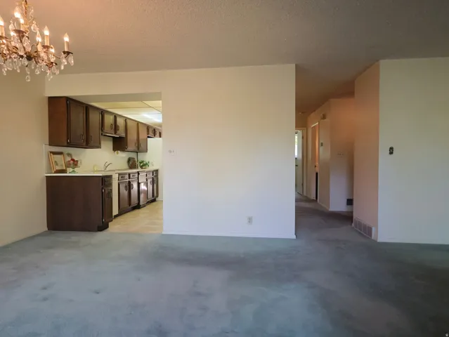 Kitchen with wood cabinetry and light countertops