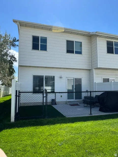 Back of townhouse with patio
