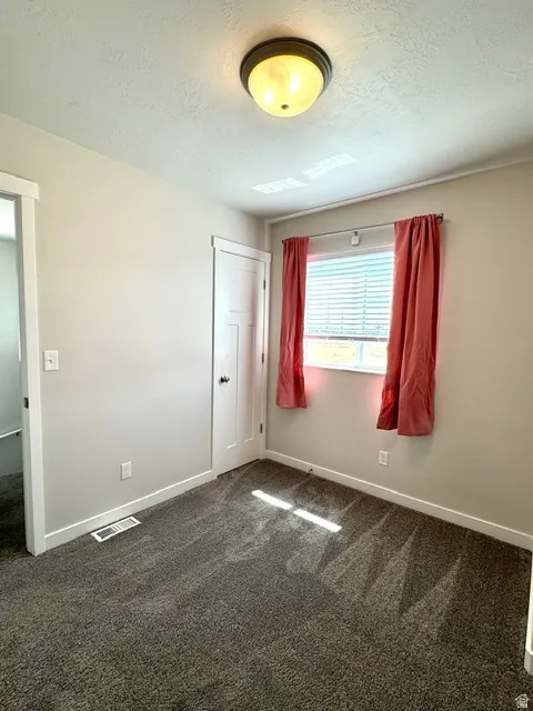 Bedroom #1 at top of stairs with south facing window
