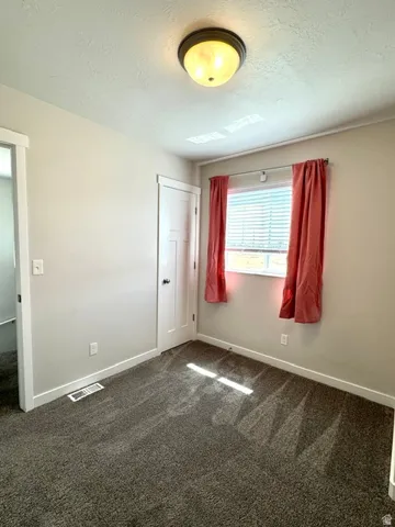 Bedroom #1 at top of stairs with south facing window
