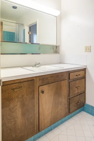 Recessed sink with a chrome faucet, set into a white countertop