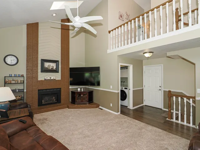 Vaulted ceiling with skylight and ceiling fan