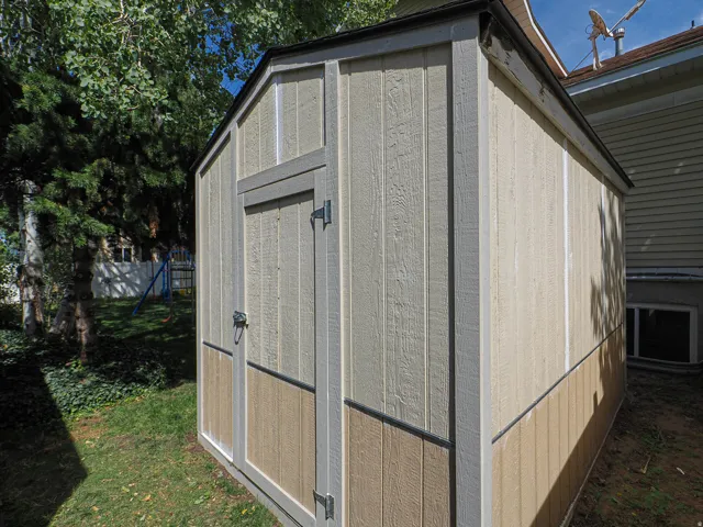 Two-tone storage shed with vertical panel siding