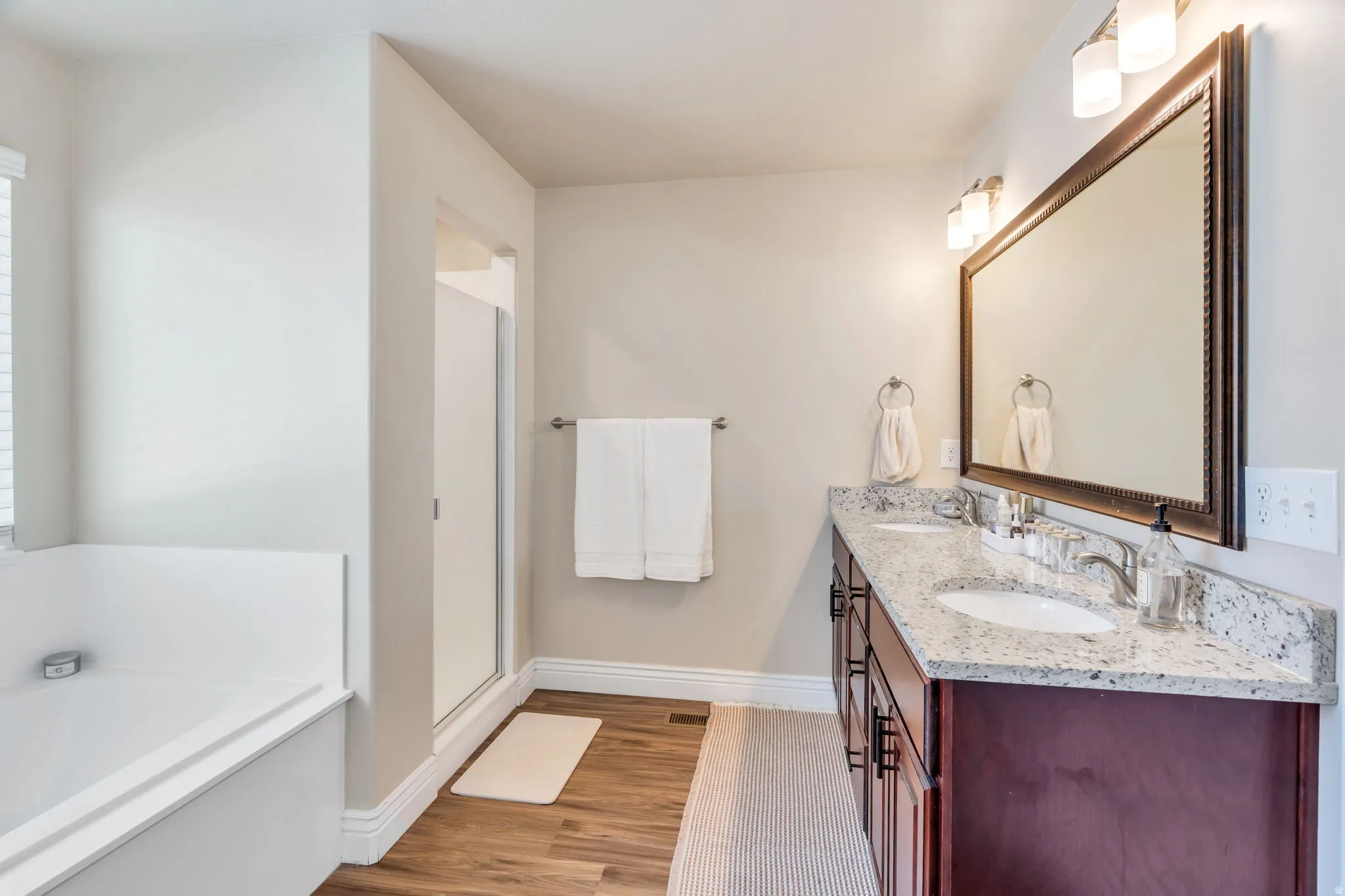 Dual vanity with granite countertop and undermount sinks