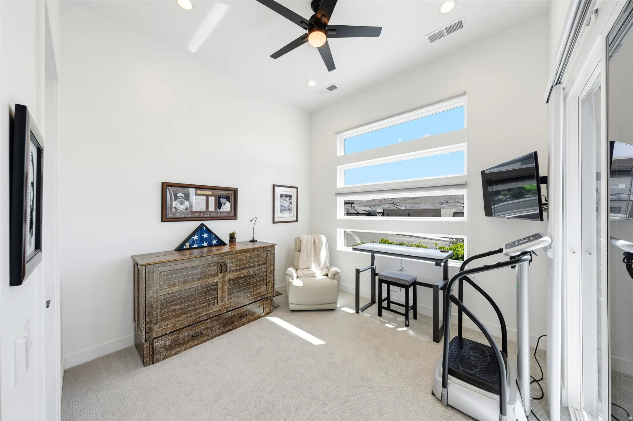 Vaulted ceiling with a ceiling fan and recessed lighting